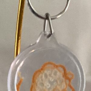 Clear acrylic keychain featuring a golden tatted mouse design with silver key ring.