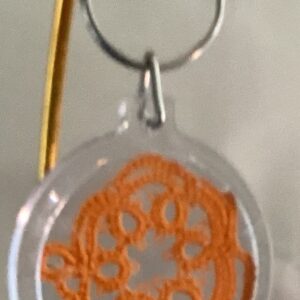 Clear acrylic keychain featuring a bright orange tatted mouse design with silver key ring.