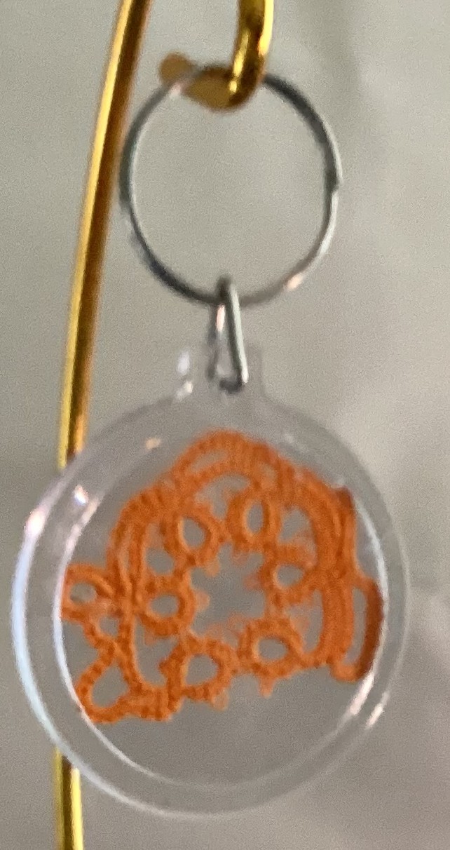 Clear acrylic keychain featuring a bright orange tatted mouse design with silver key ring.
