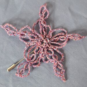 Hand-tatted patriotic hat and lapel pin in variegated red, white, and blue featuring an intricate openwork lace design with a silver pin back.