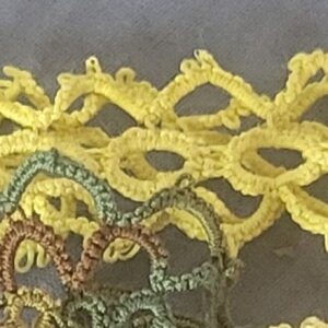 Golden yellow hand-tatted lace hat band with intricate floral and diamond pattern