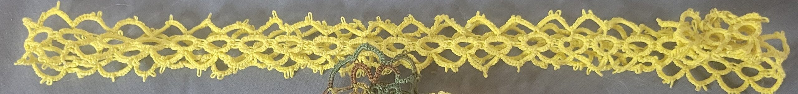 Golden yellow hand-tatted lace hat band with intricate floral and diamond pattern