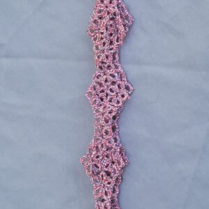 Red, white, and blue hand-tatted lace hat band made with Size 20 thread and featuring an intricate repeating pattern