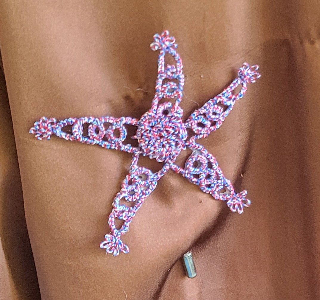 Patriotic Star hand-tatted hat and lapel pin in red, white, and blue variegated thread